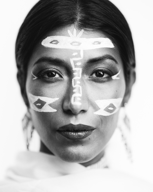 Interesting close shot black and white portrait photo of women with face paints.  